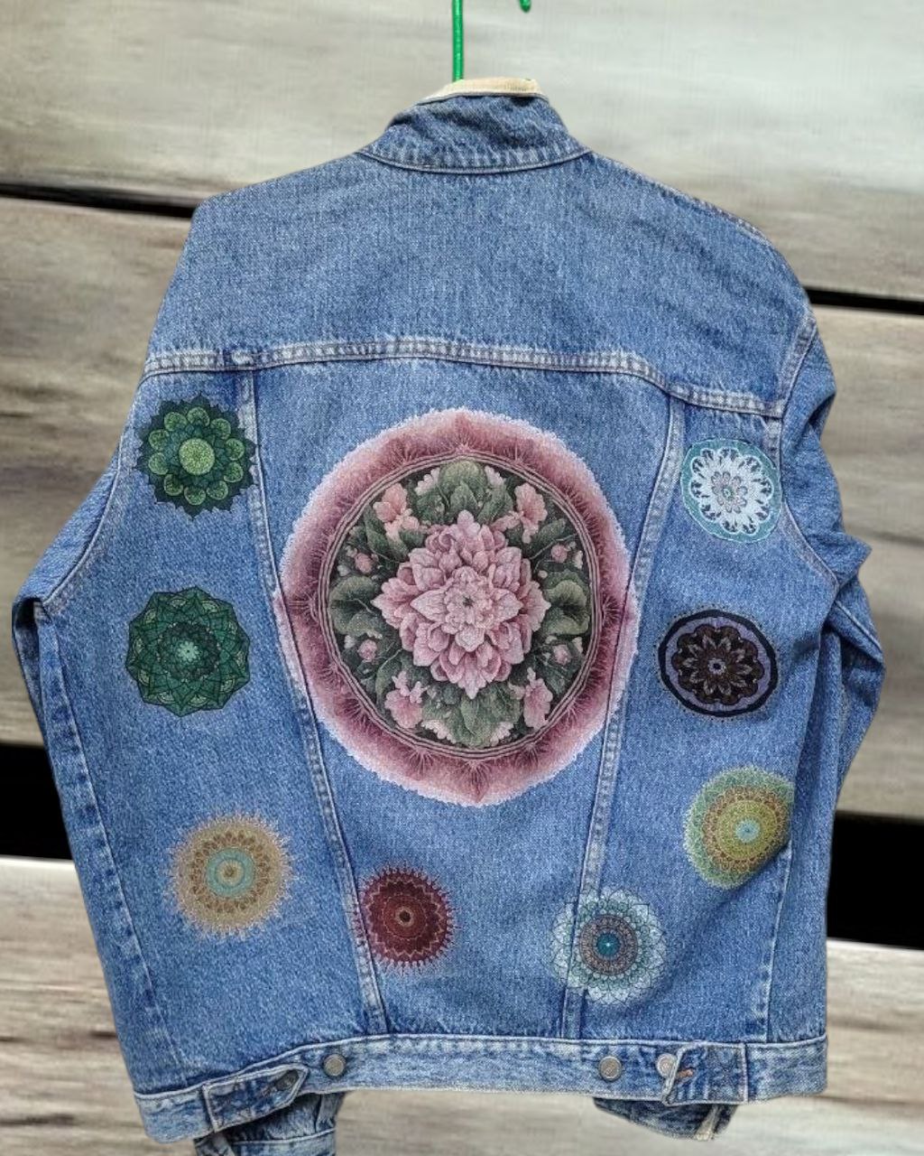 a picture of mandala printed on a denim jacket