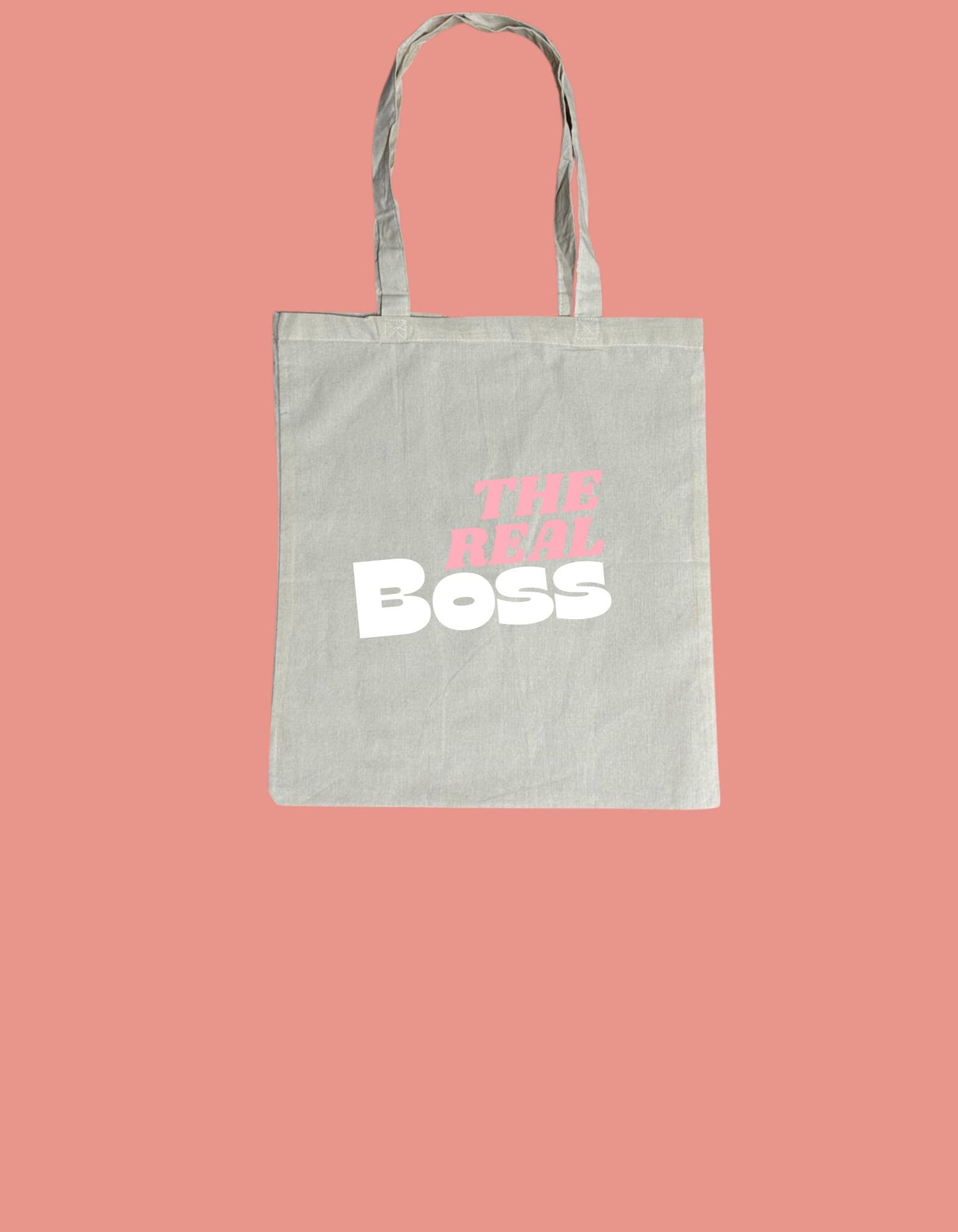 a bag with the words the real boss printed on it