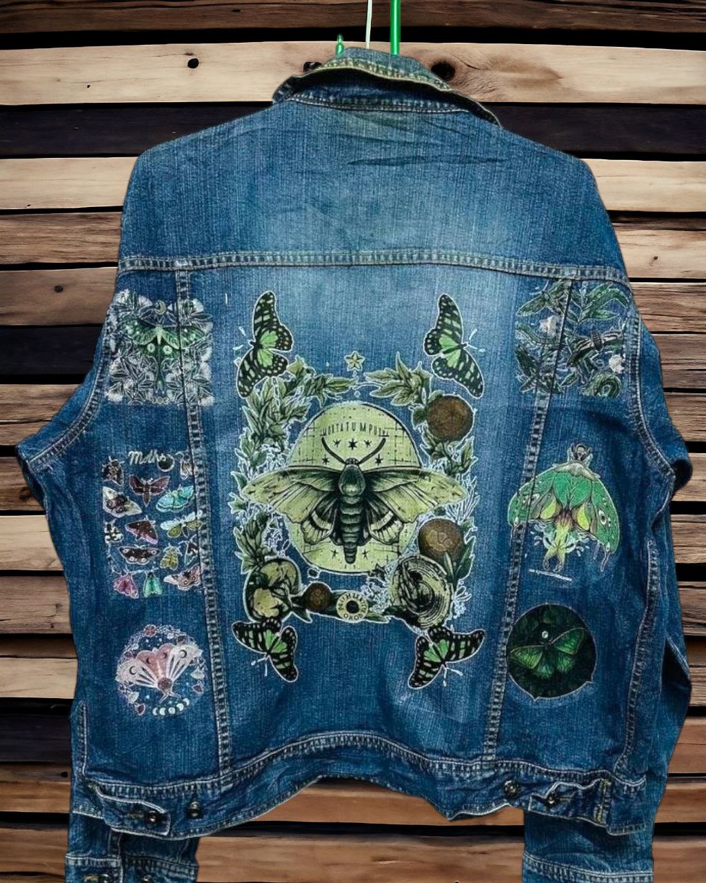 a denim jacket with pictures of bohemian moth printed on it