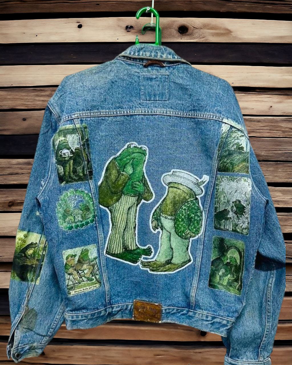 a denim jacket with pictures of frog and toad printed on it