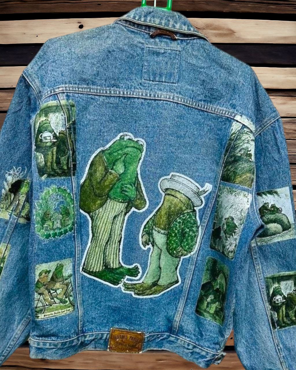 a denim jacket with pictures of frog and toad printed on it