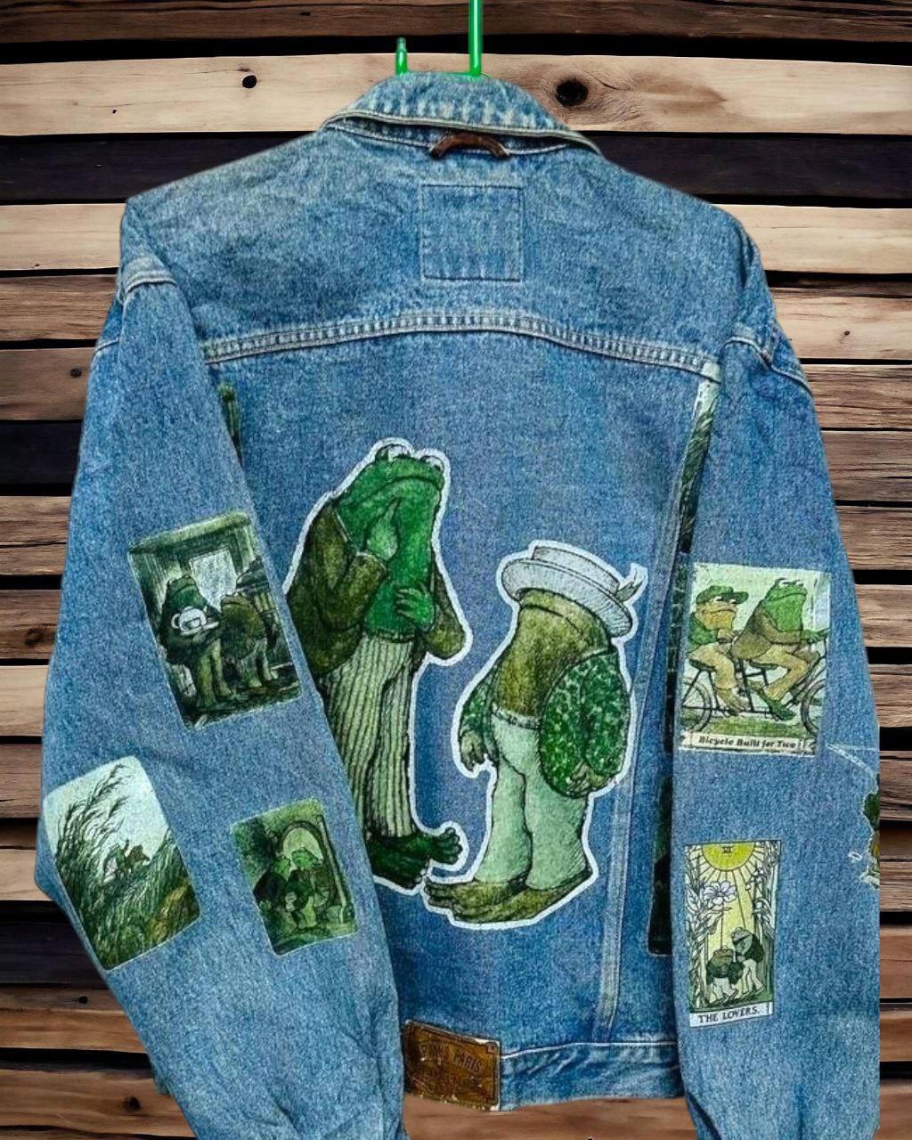 a denim jacket with pictures of frog and toad printed on it