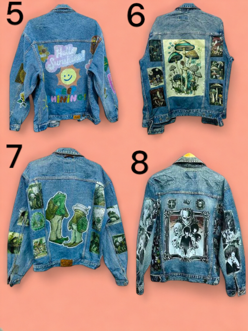 a group of music rock band printed jean jackets hanging on a wooden wall