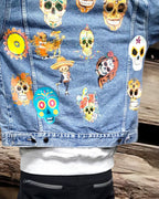 a denim jacket with pictures of sugarskull printed on it