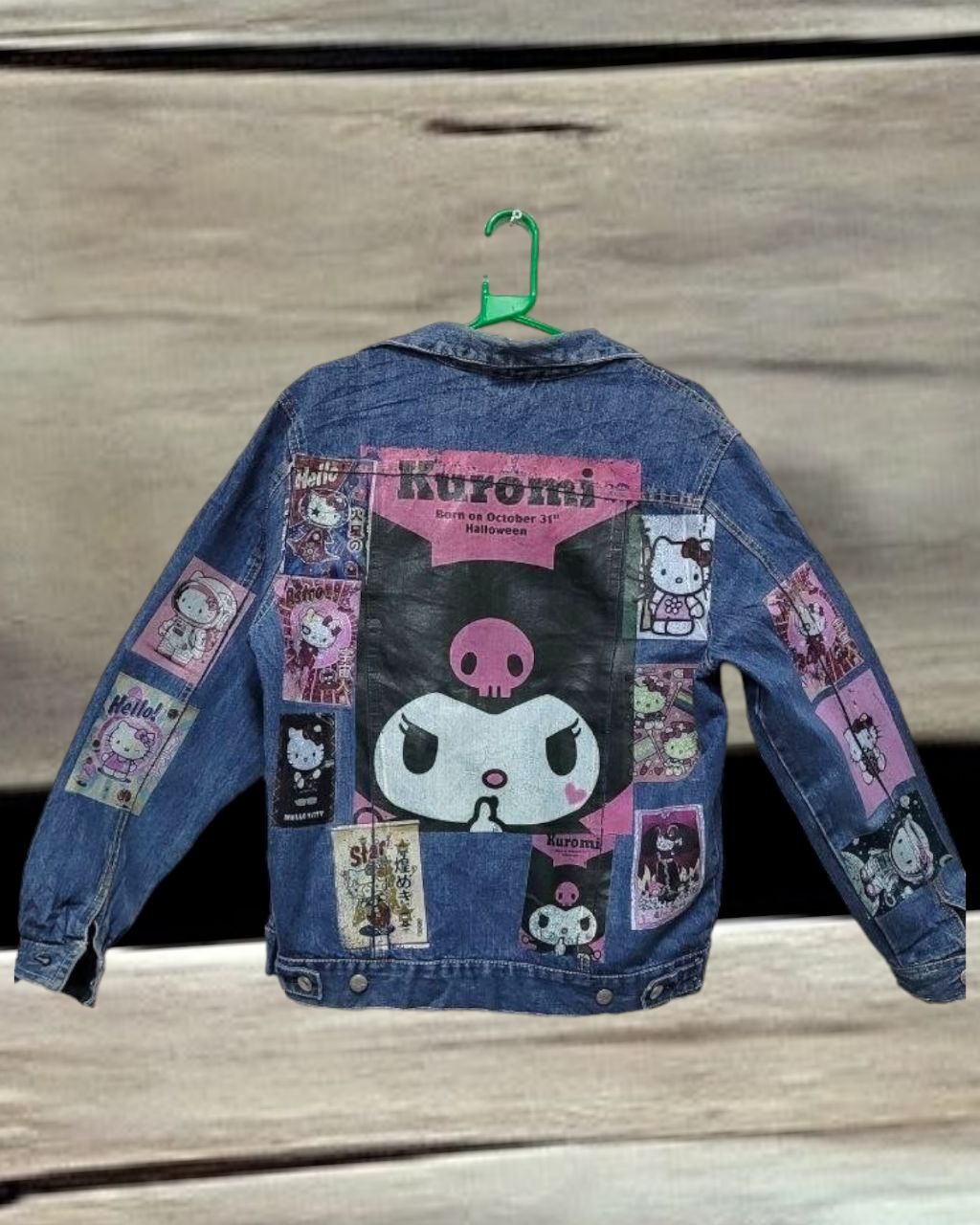 a picture of hello kitty karumi printed on a denim jacket 