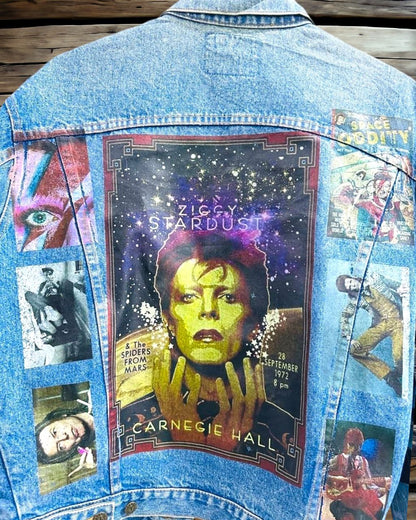 a denim jacket with pictures of david bowie printed on it
