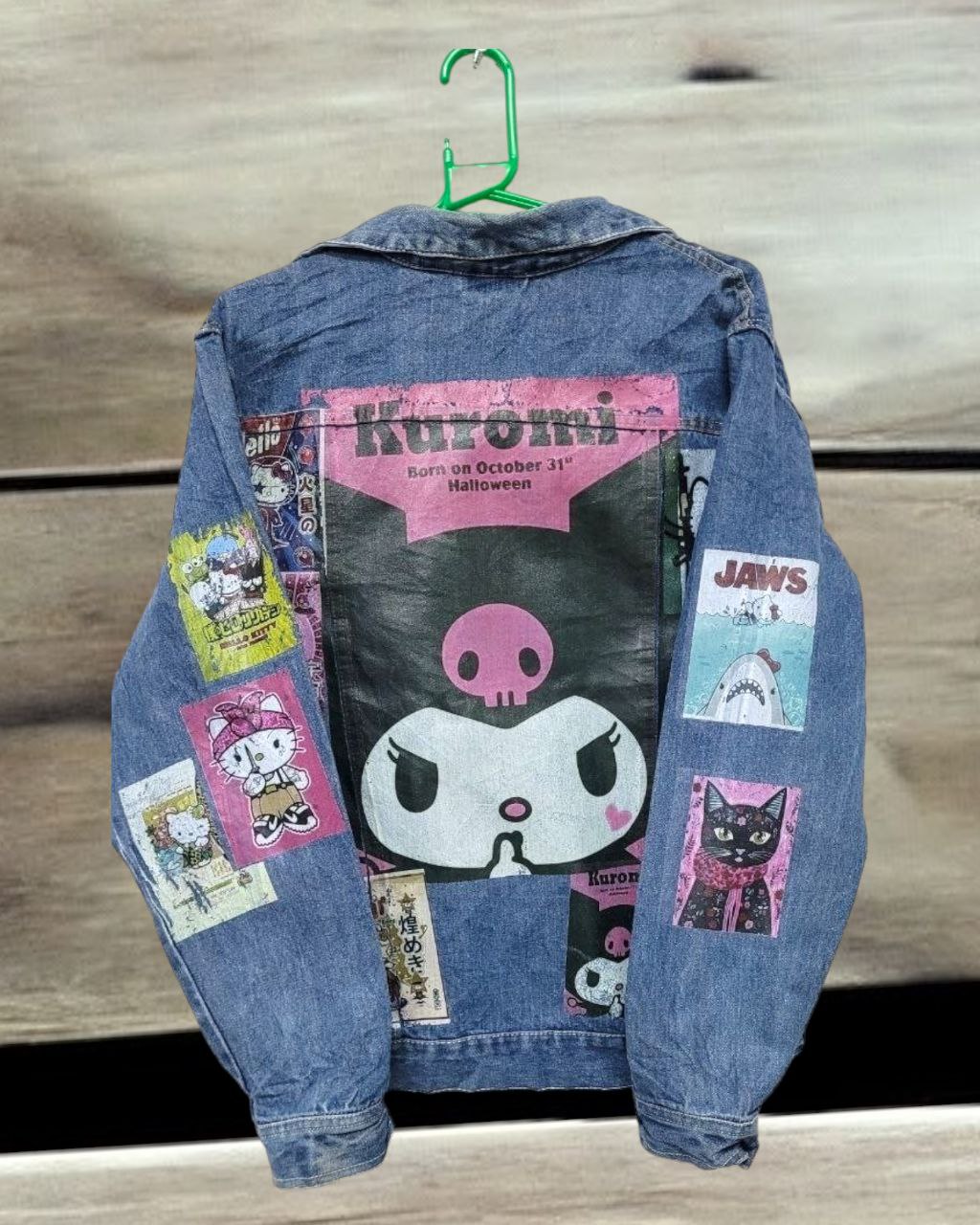 a picture of hello kitty karumi printed on a denim jacket 