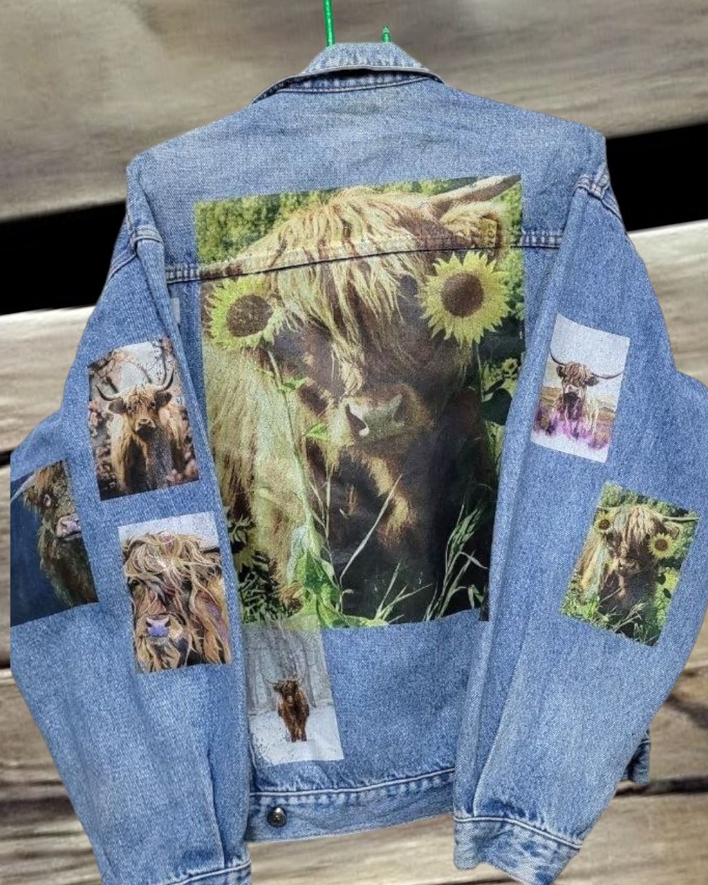 a denim jacket with pictures of  himalayan cow printed on it