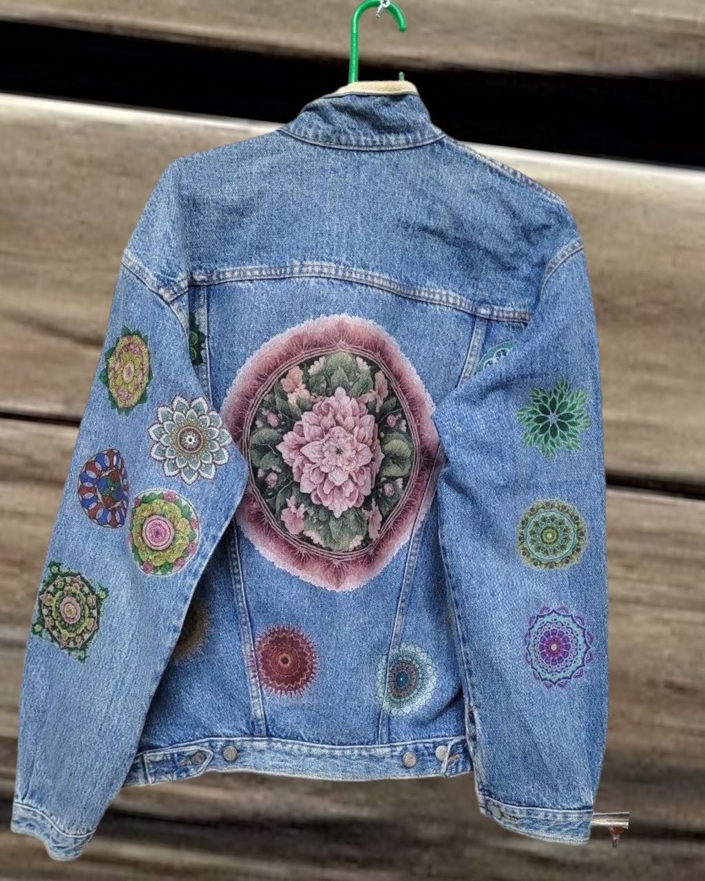 a picture of mandala printed on a denim jacket 