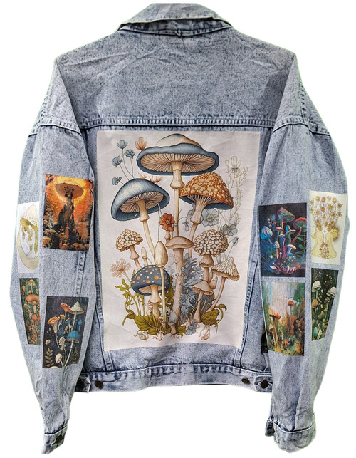 Denim jacket with mushroom-themed patchwork design on a white background