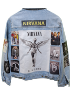 Denim jacket with Nirvana album cover and images on a white background