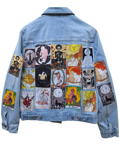 Denim jacket with tarot card designs on a white background