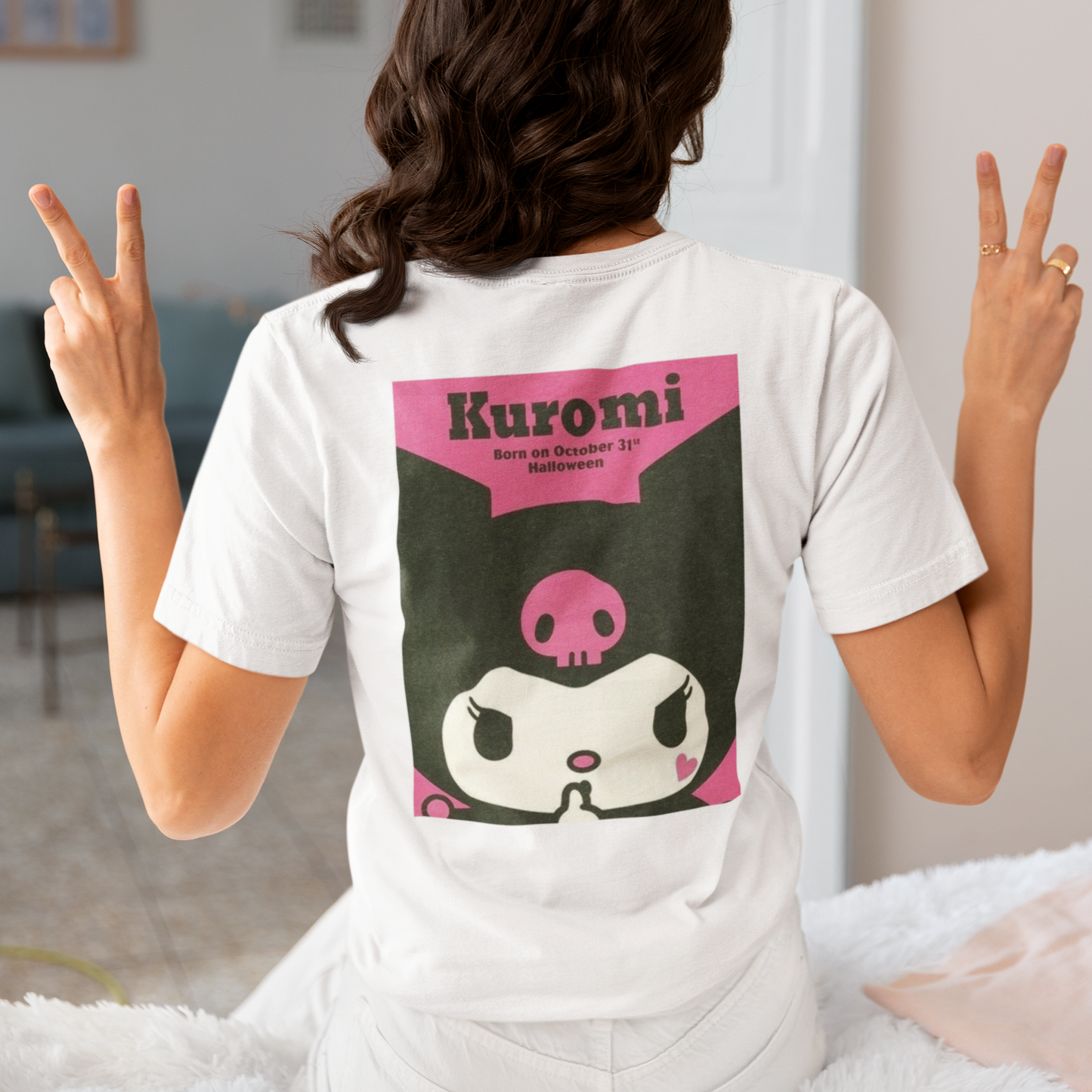 a woman wearing a white Kuromi Hello Kitty T-shirt