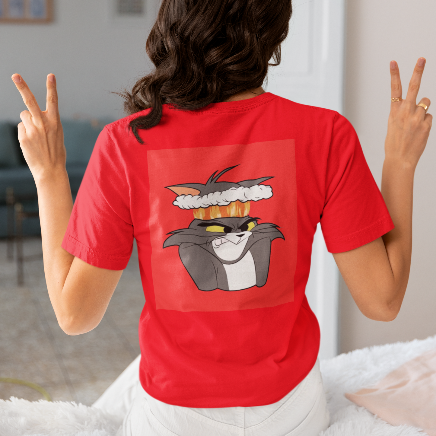 a picture of a woman wearing a red Tom and Gerry cartoon  t - shirt 