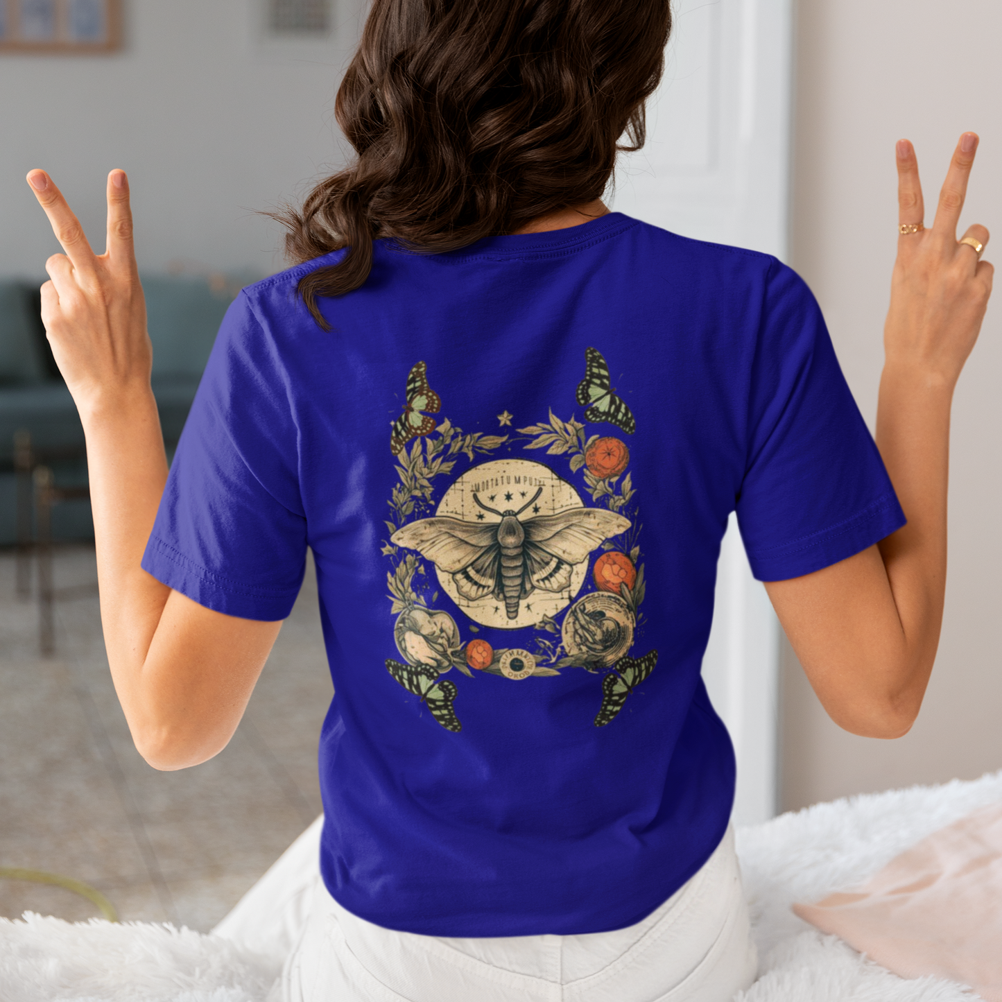 a picture of a woman wearing a blue Bohemian moth t - shirt 