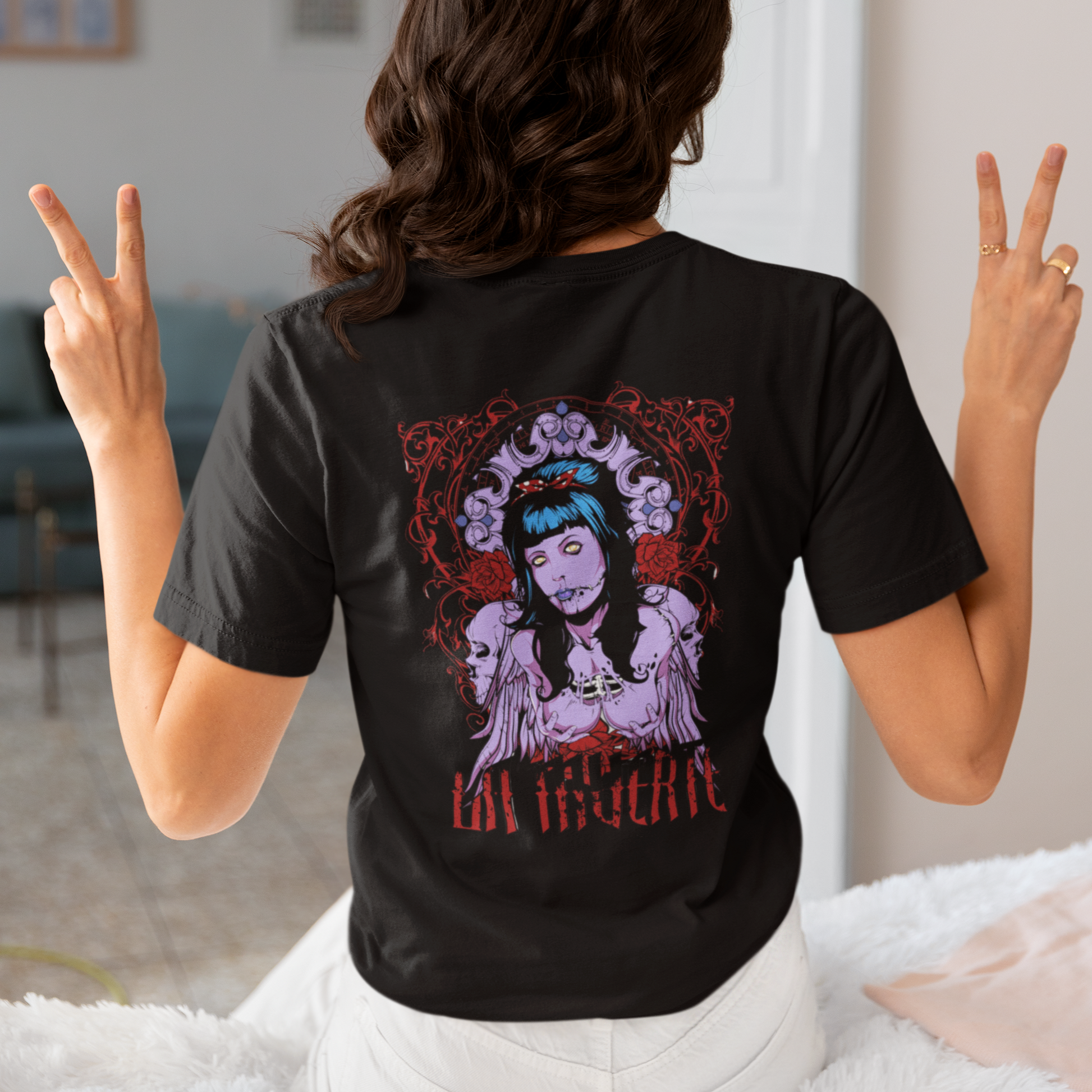 a woman wearing a black La Muerte T-shirt