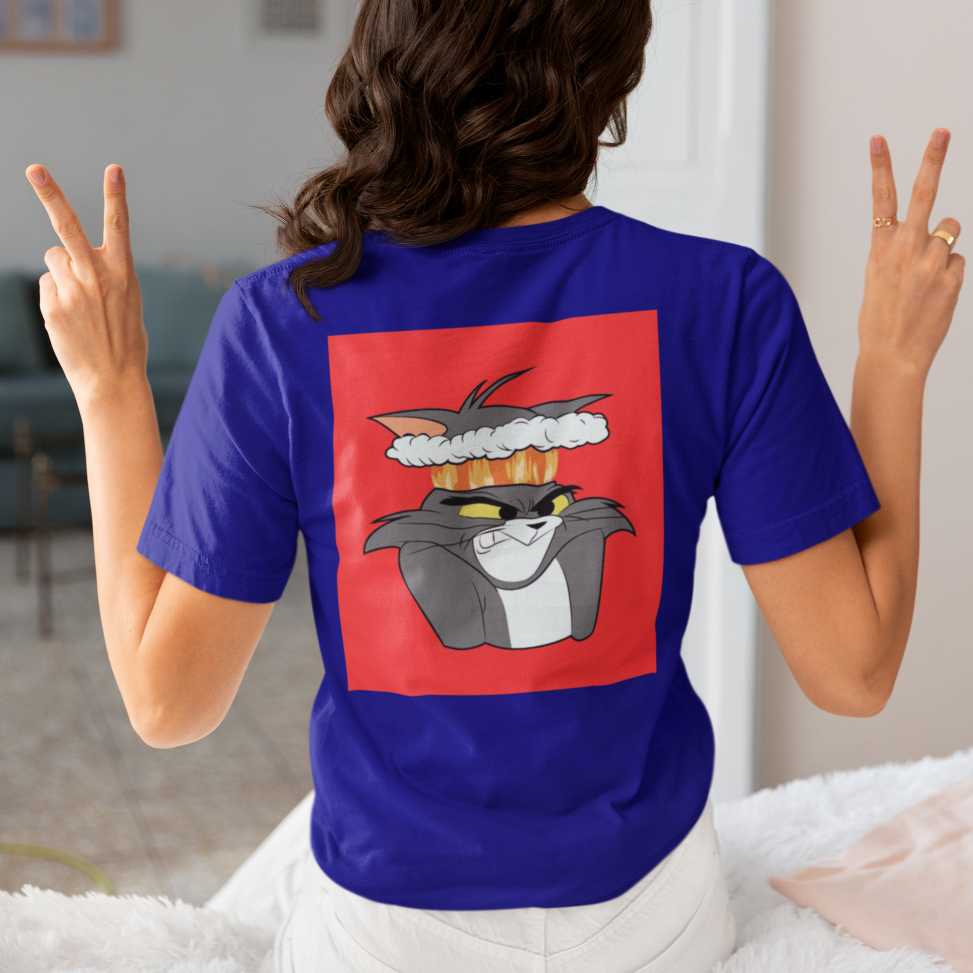 a picture of a woman wearing a blue Tom and Gerry cartoon  t - shirt 