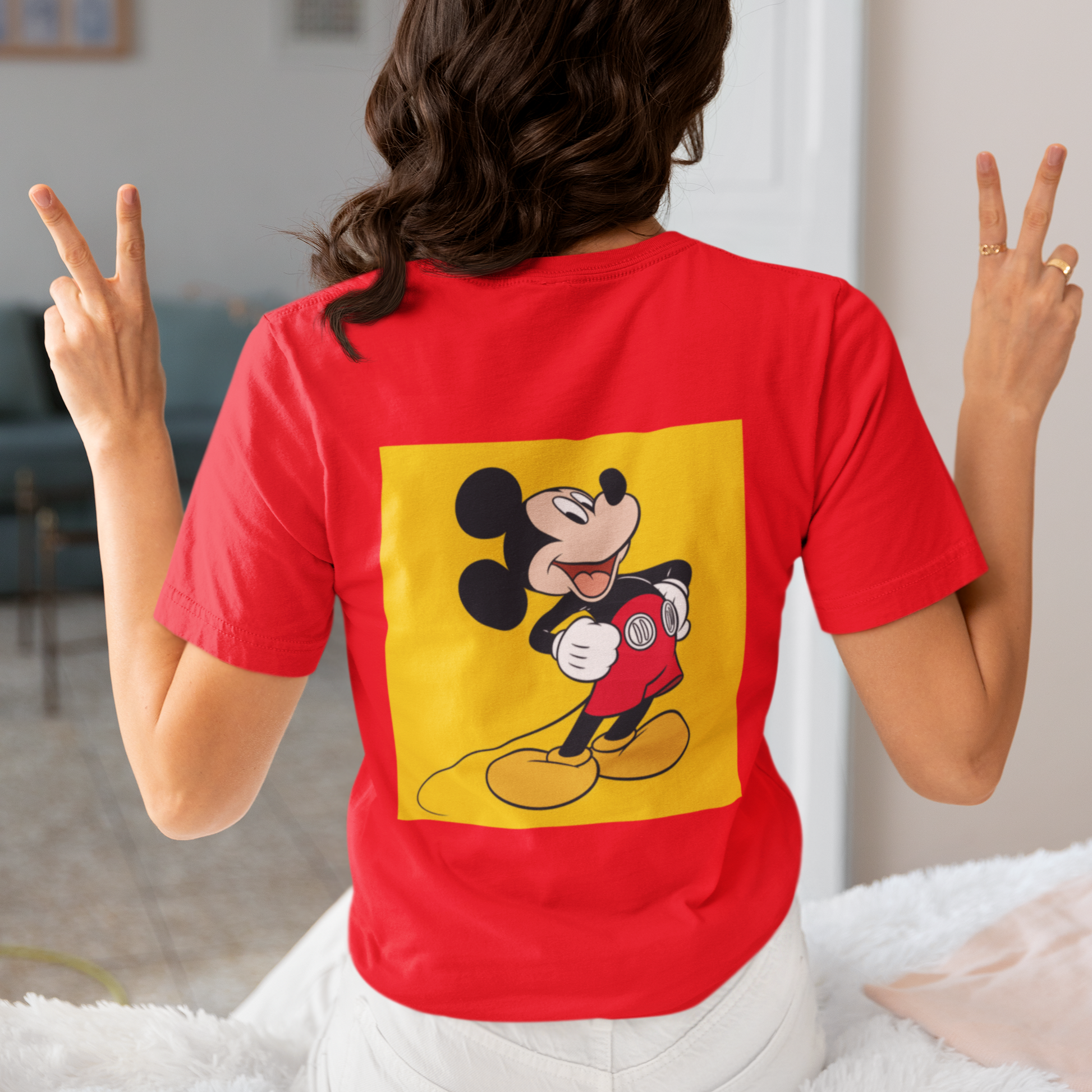 a woman wearing a red Mickey mouse T-shirt