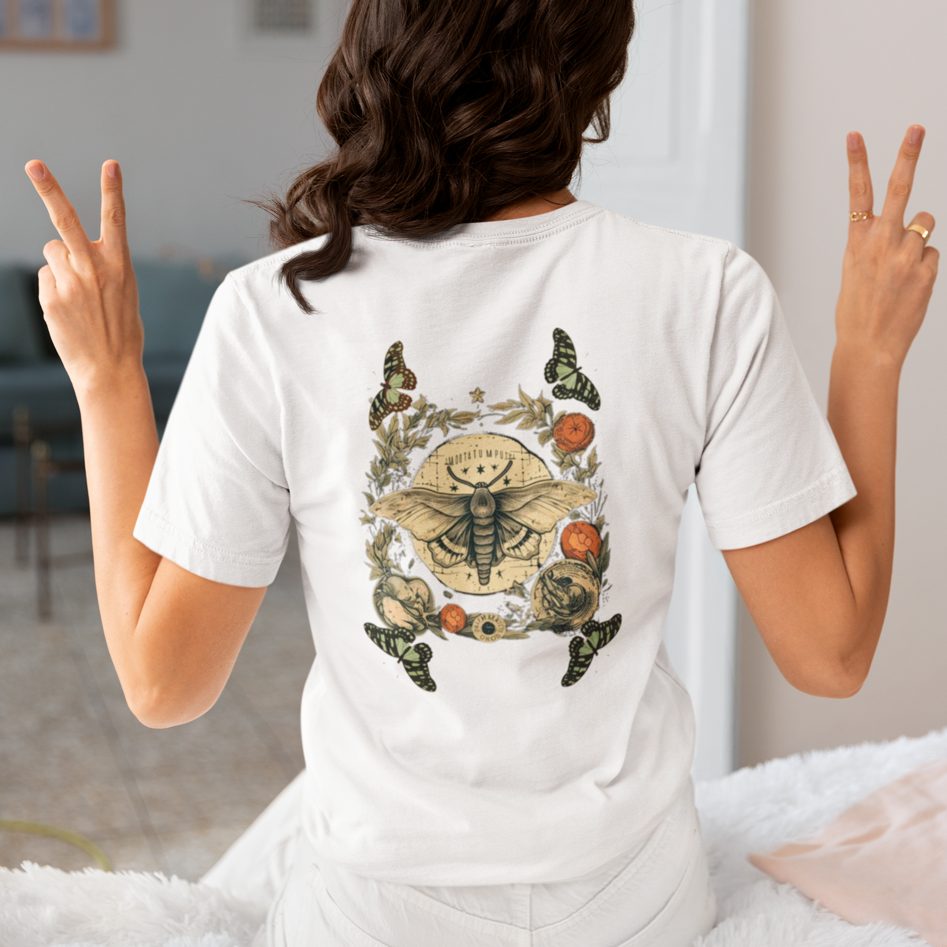 a picture of a woman wearing a white Bohemian moth t - shirt 