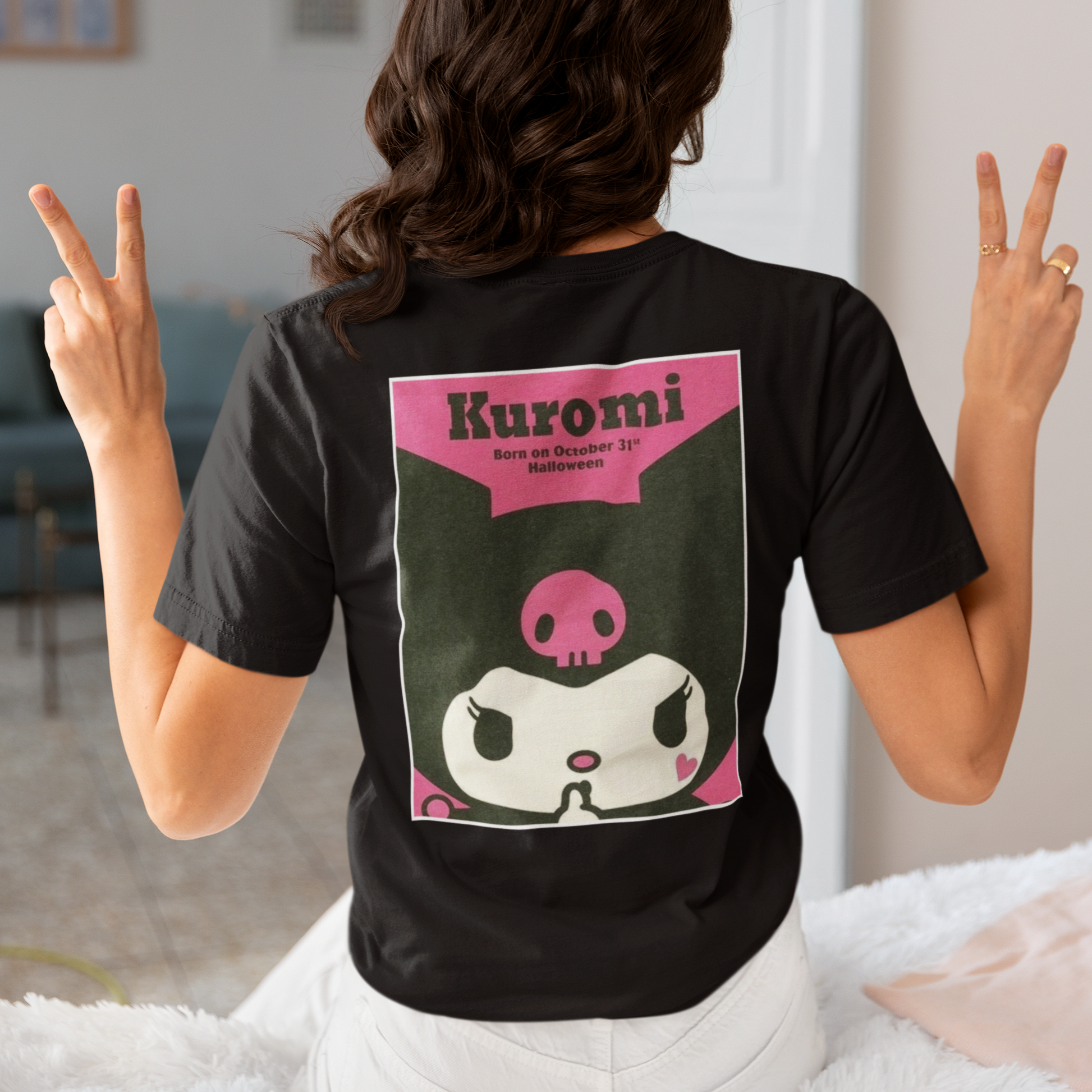 a woman wearing a black Kuromi Hello Kitty T-shirt