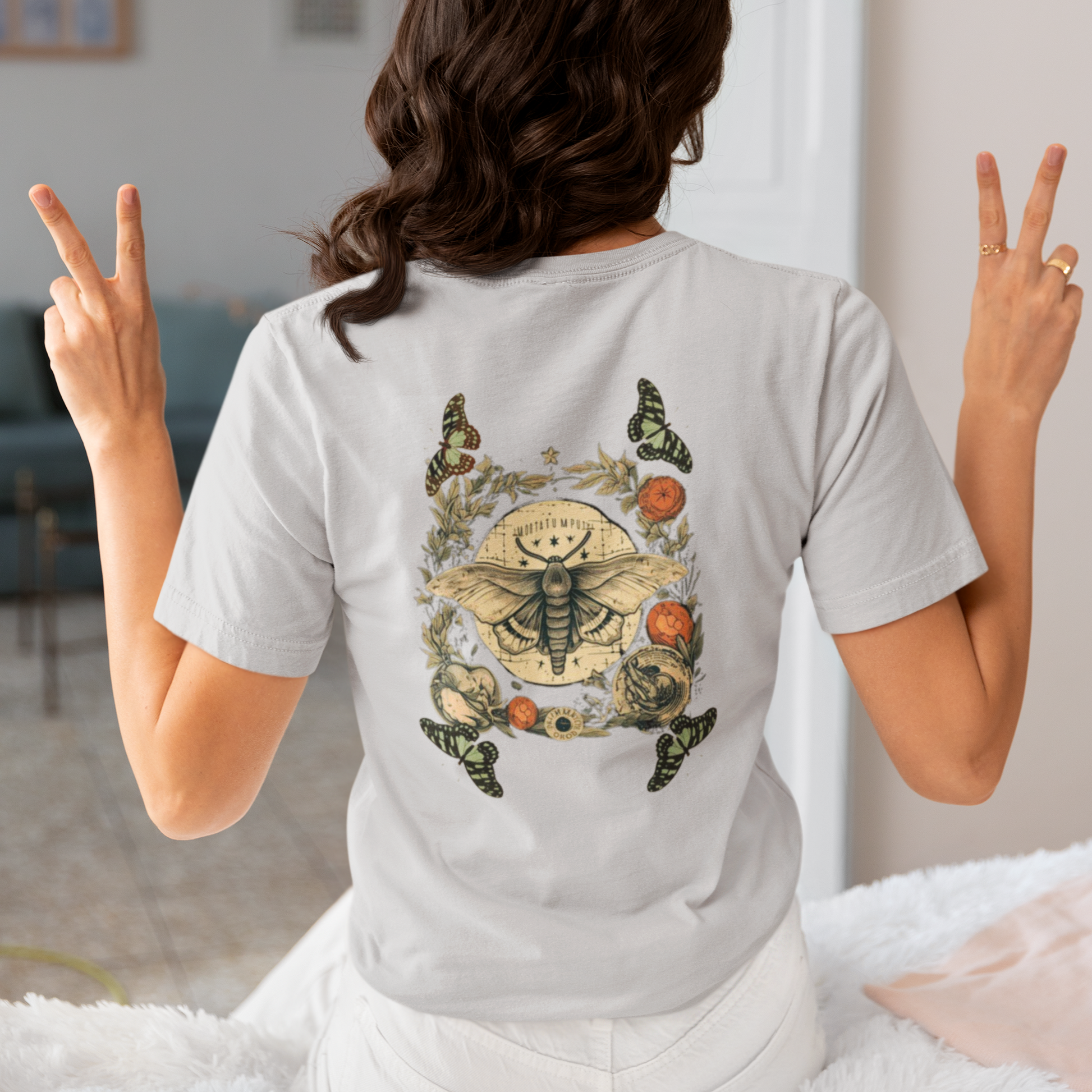 a picture of a woman wearing a grey Bohemian moth t - shirt 