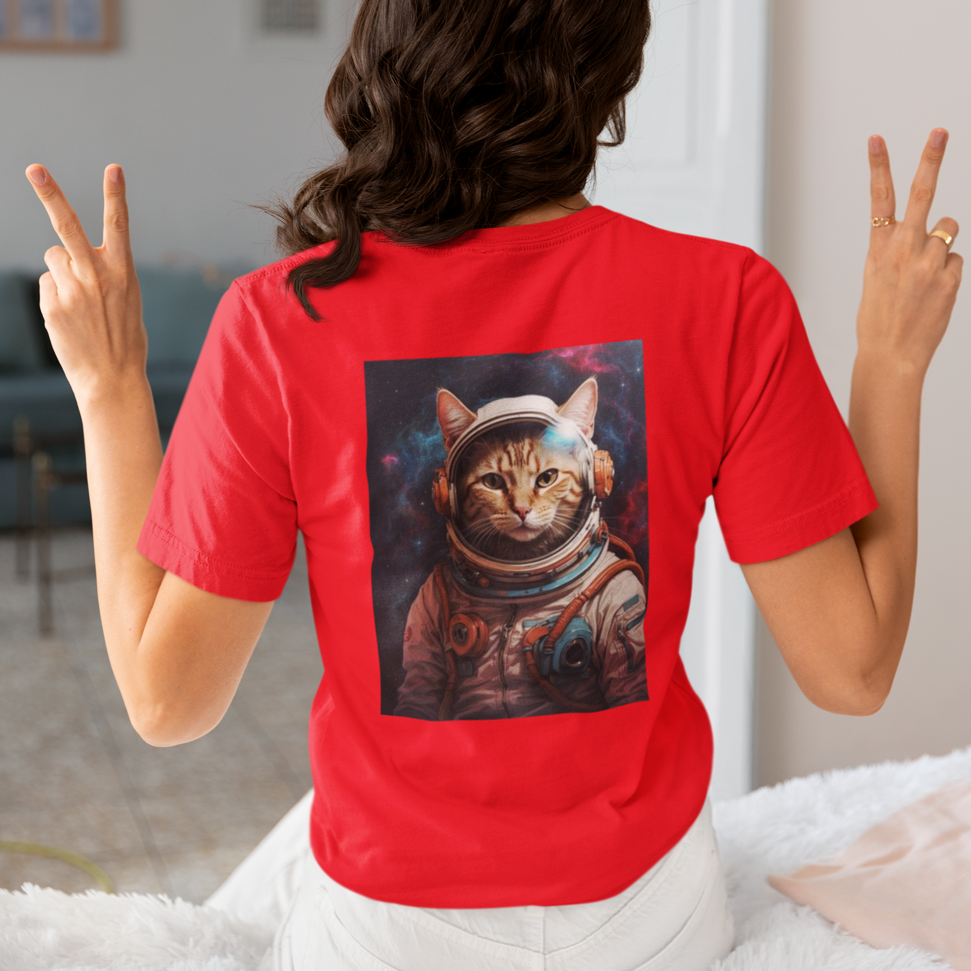 a woman wearing a red space cat T-shirt