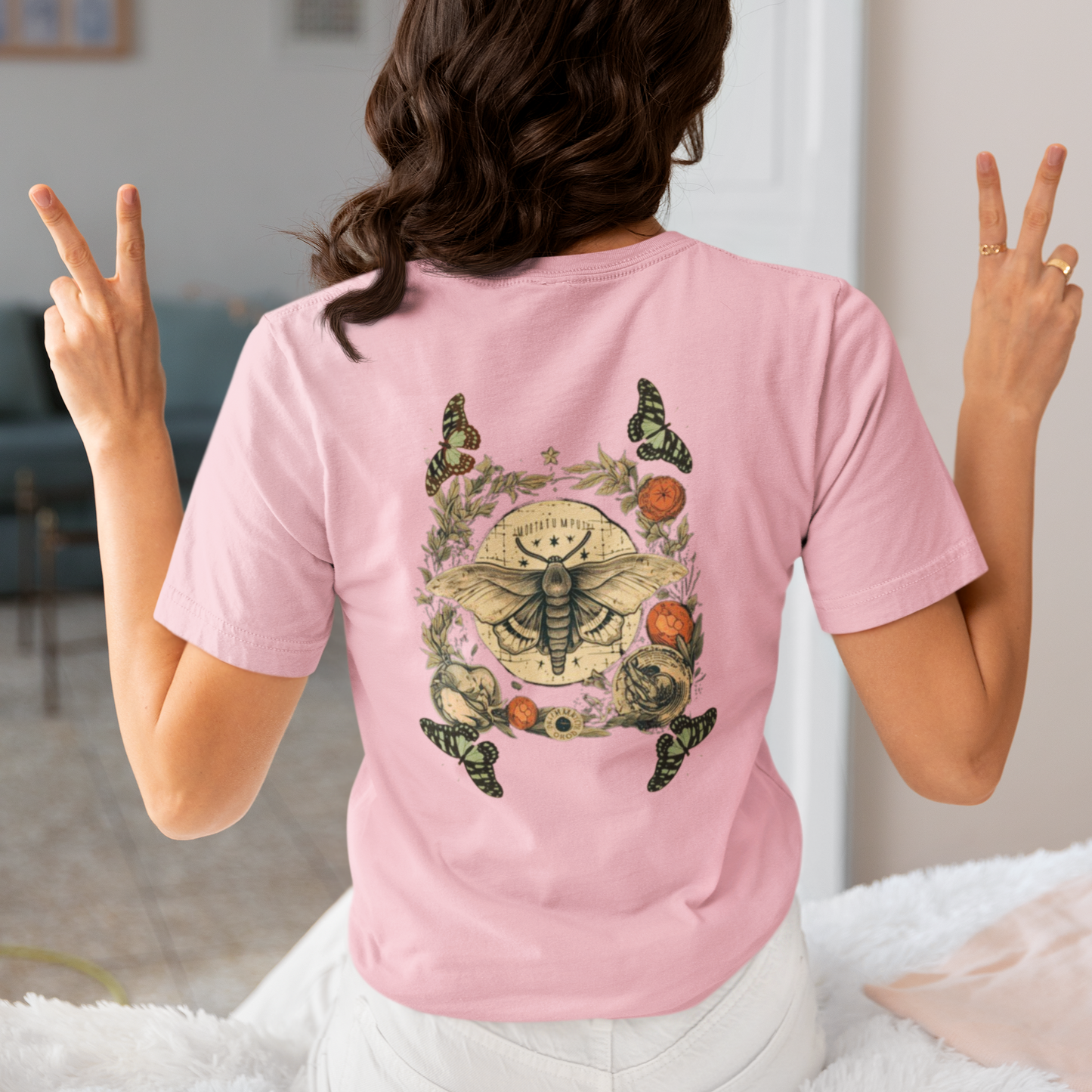 a picture of a woman wearing a pink Bohemian moth t - shirt 