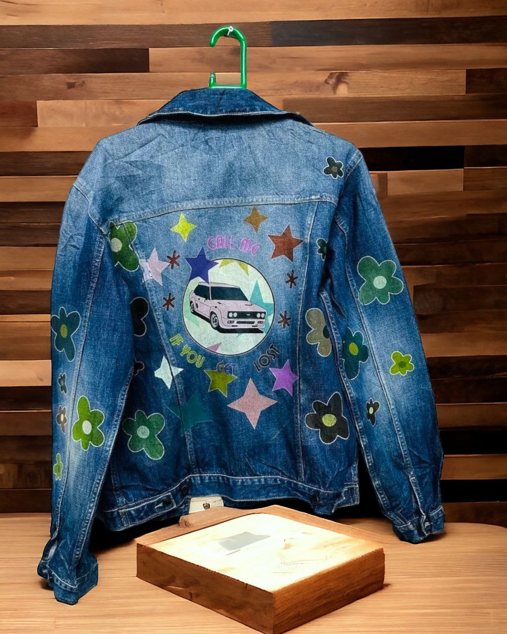 a denim jacket with pictures of taylor the creator printed on it