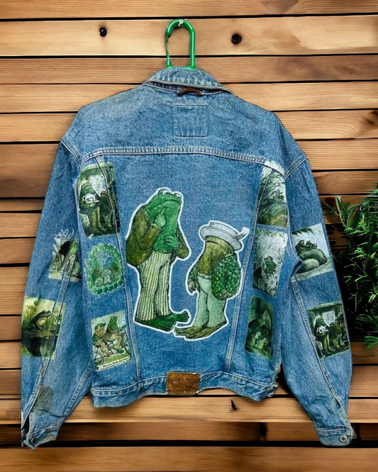 a denim jacket with pictures of frog and toad printed on it