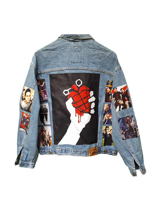 Denim jacket with graphic designs on a white background