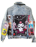 Denim jacket with cartoon character patches on a white background