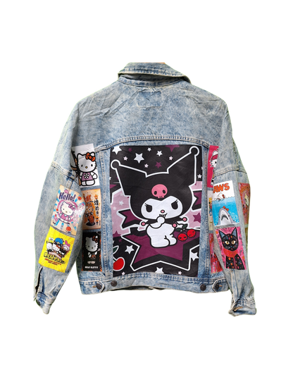 Denim jacket with colorful patches and graphics on a white background