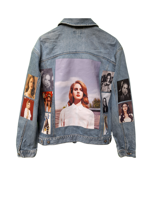 Denim jacket with collage of images on a white background