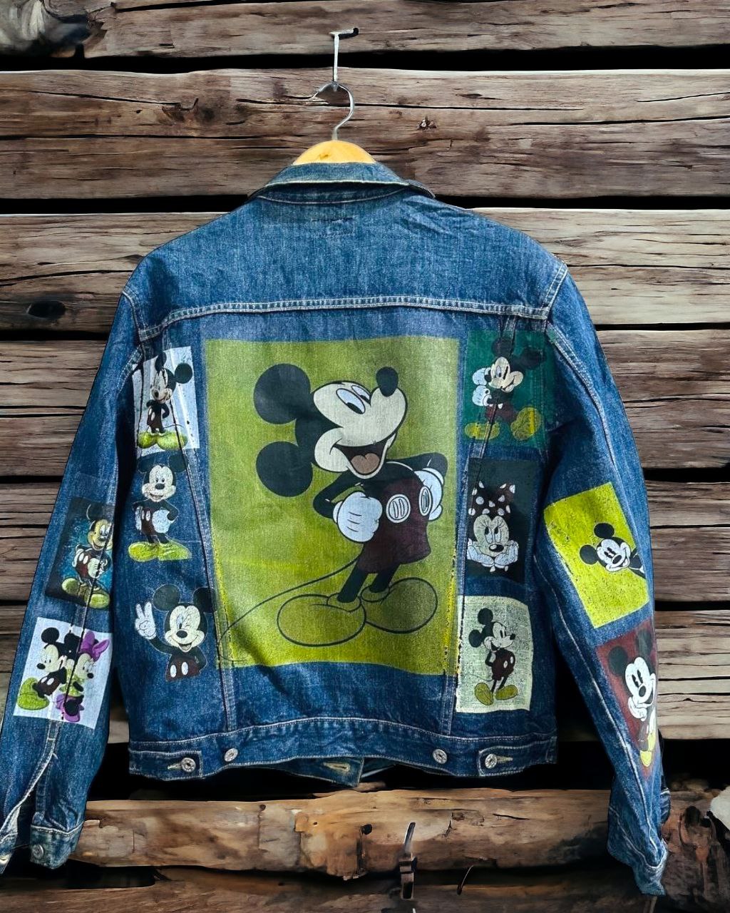 a picture of mickey mouse printed on a denim jacket 