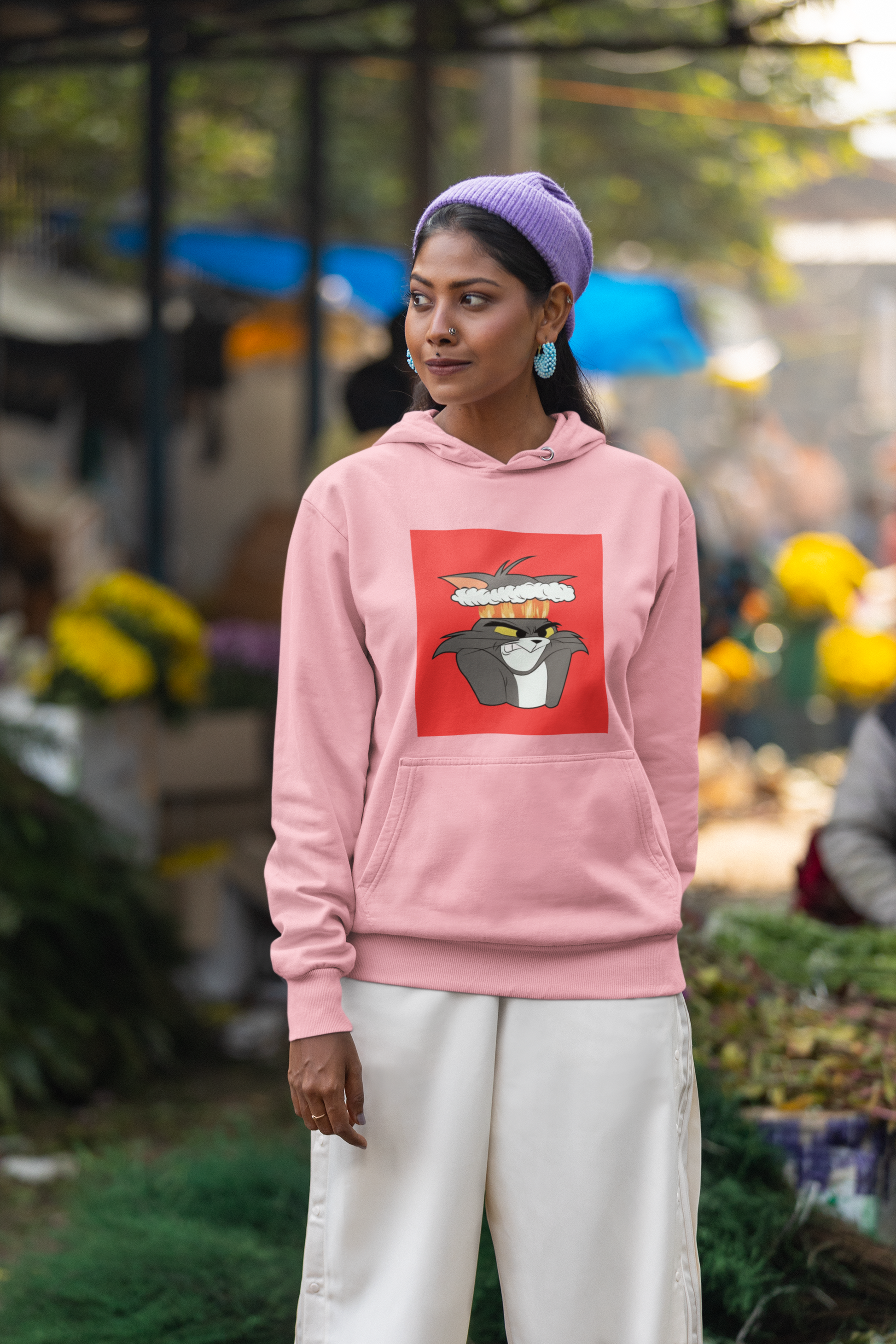 a picture of a woman wearing a pink tom Cartoon from tom and gerry hoodie