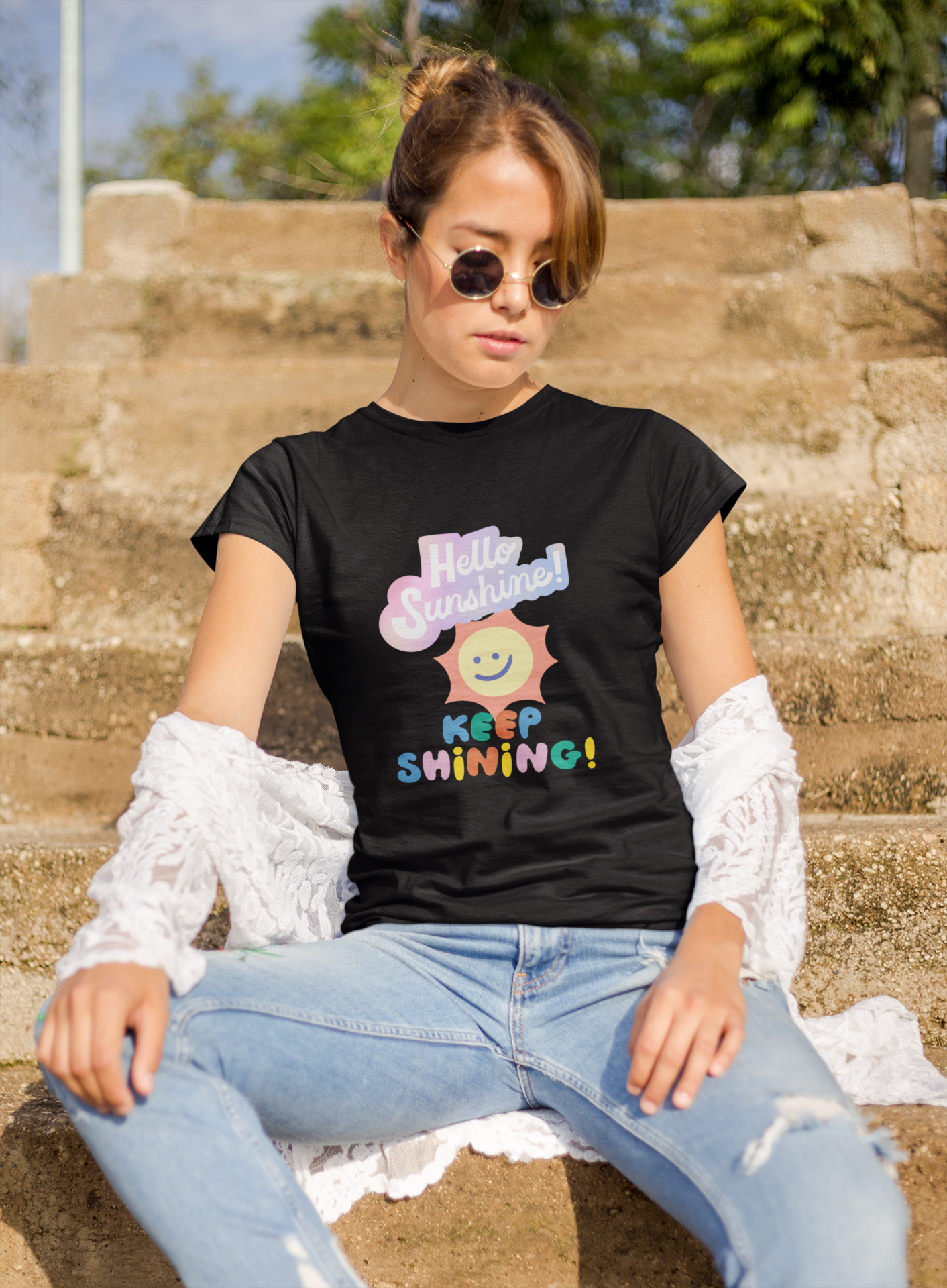 a woman wearing a black letter and expression T-shirt