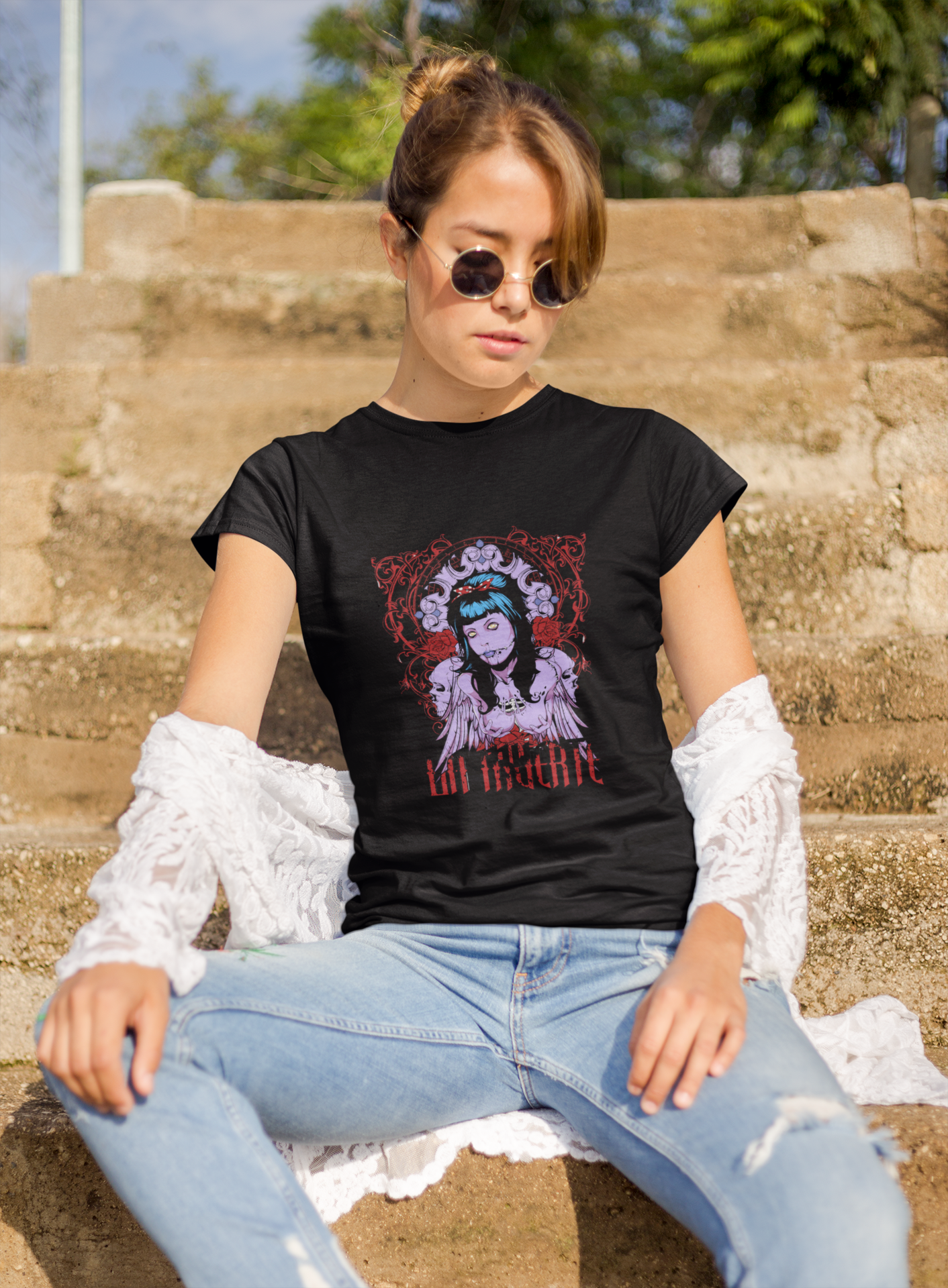 a woman wearing a black La Muerte T-shirt