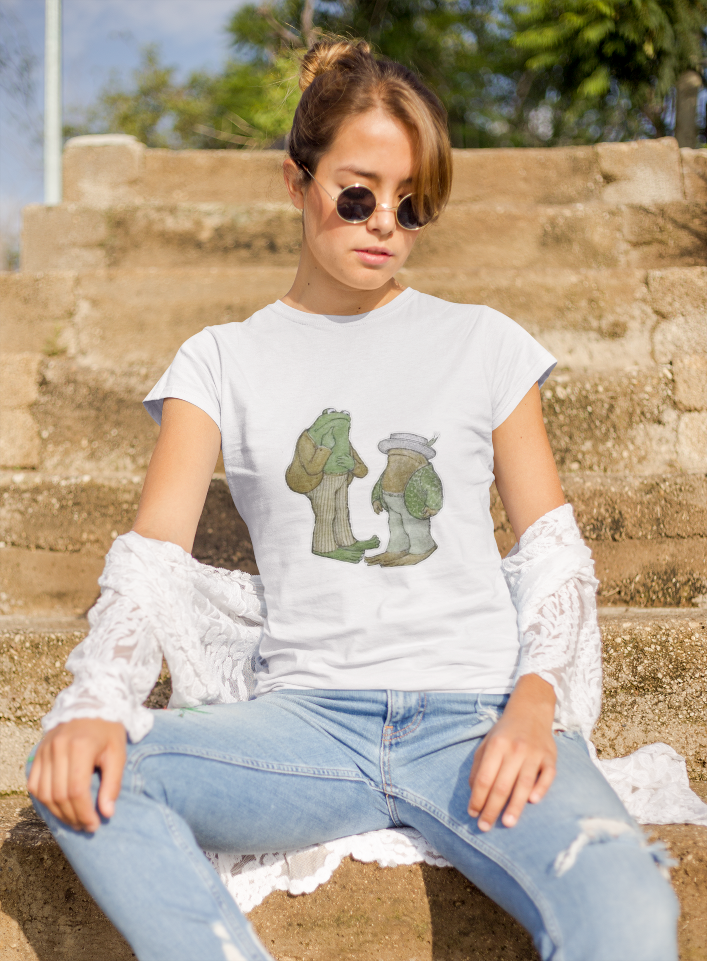 a woman wearing a white frog and toad  t - shirt