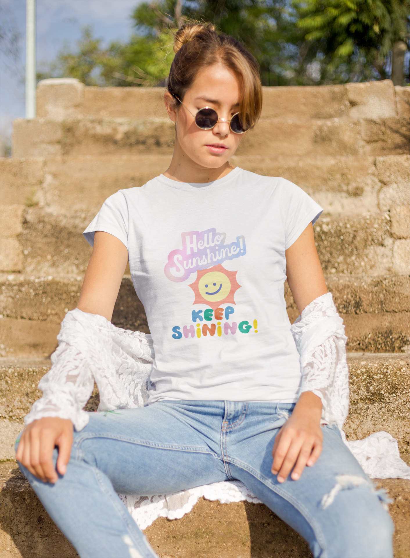 a woman wearing a white letter and expression T-shirt