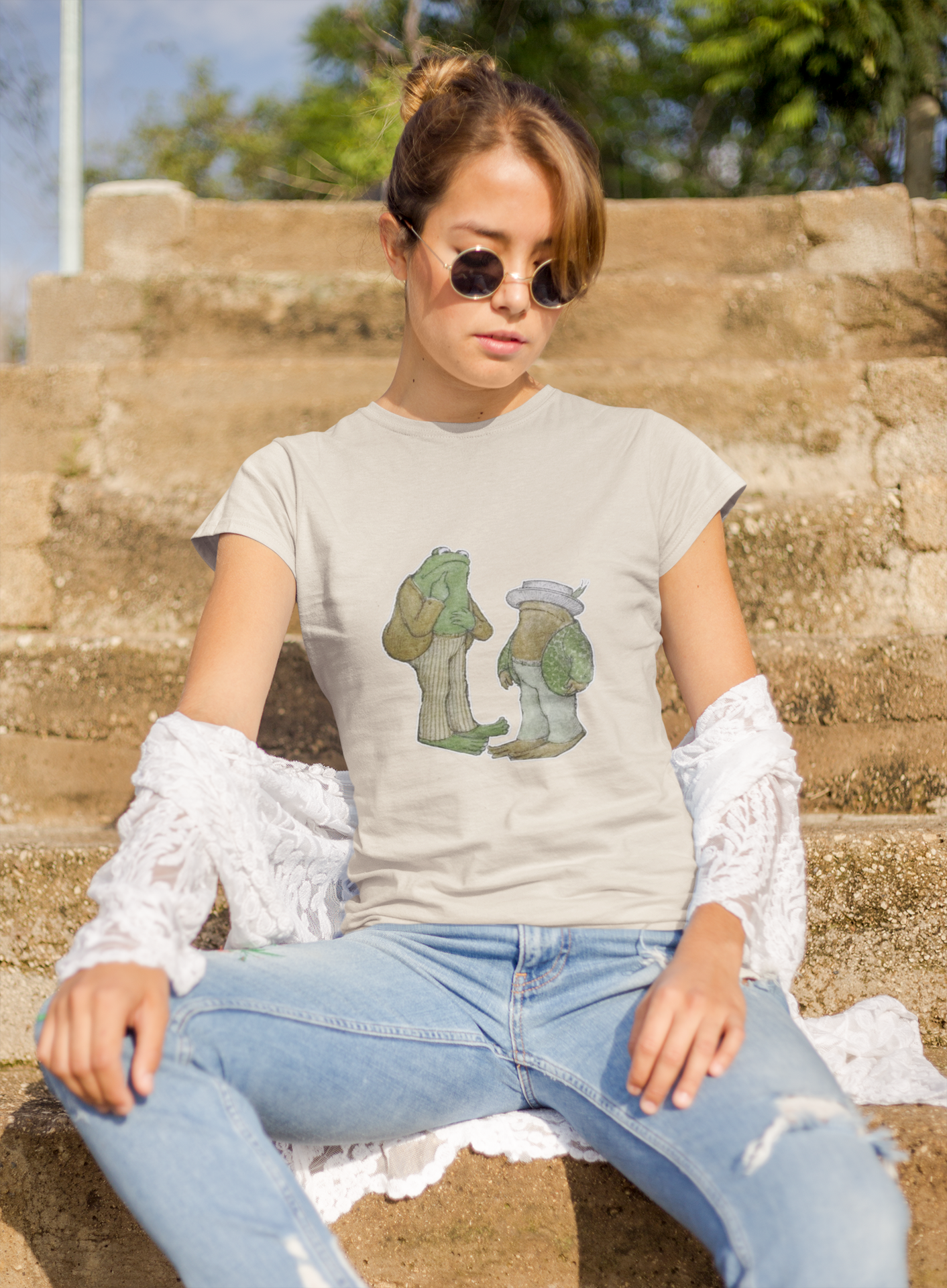 a woman wearing a grey frog and toad  t - shirt