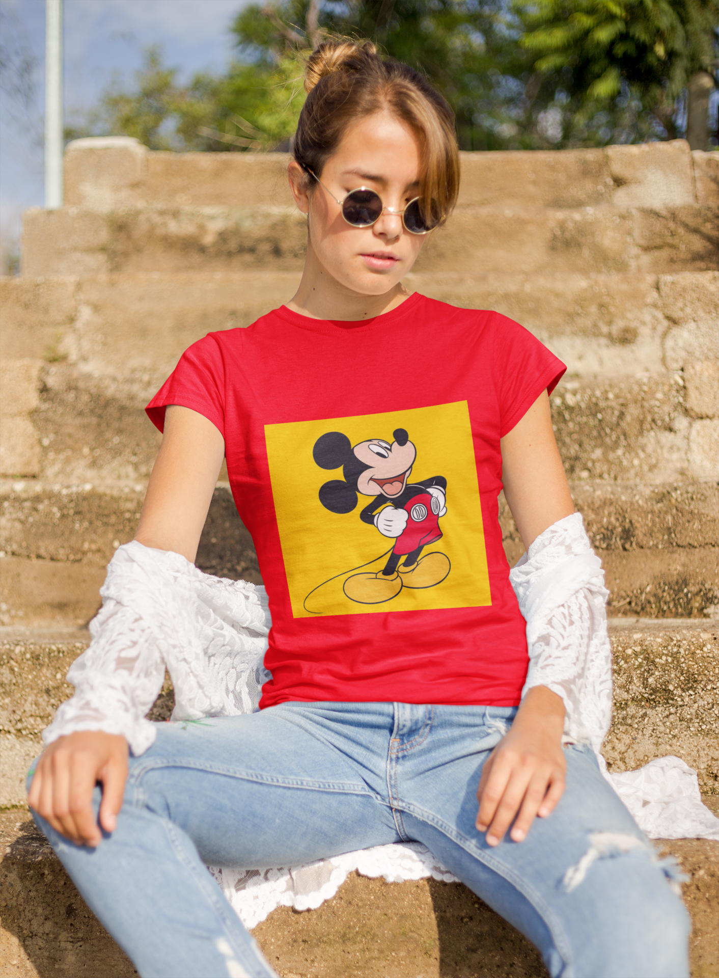 a woman wearing a red Mickey mouse T-shirt