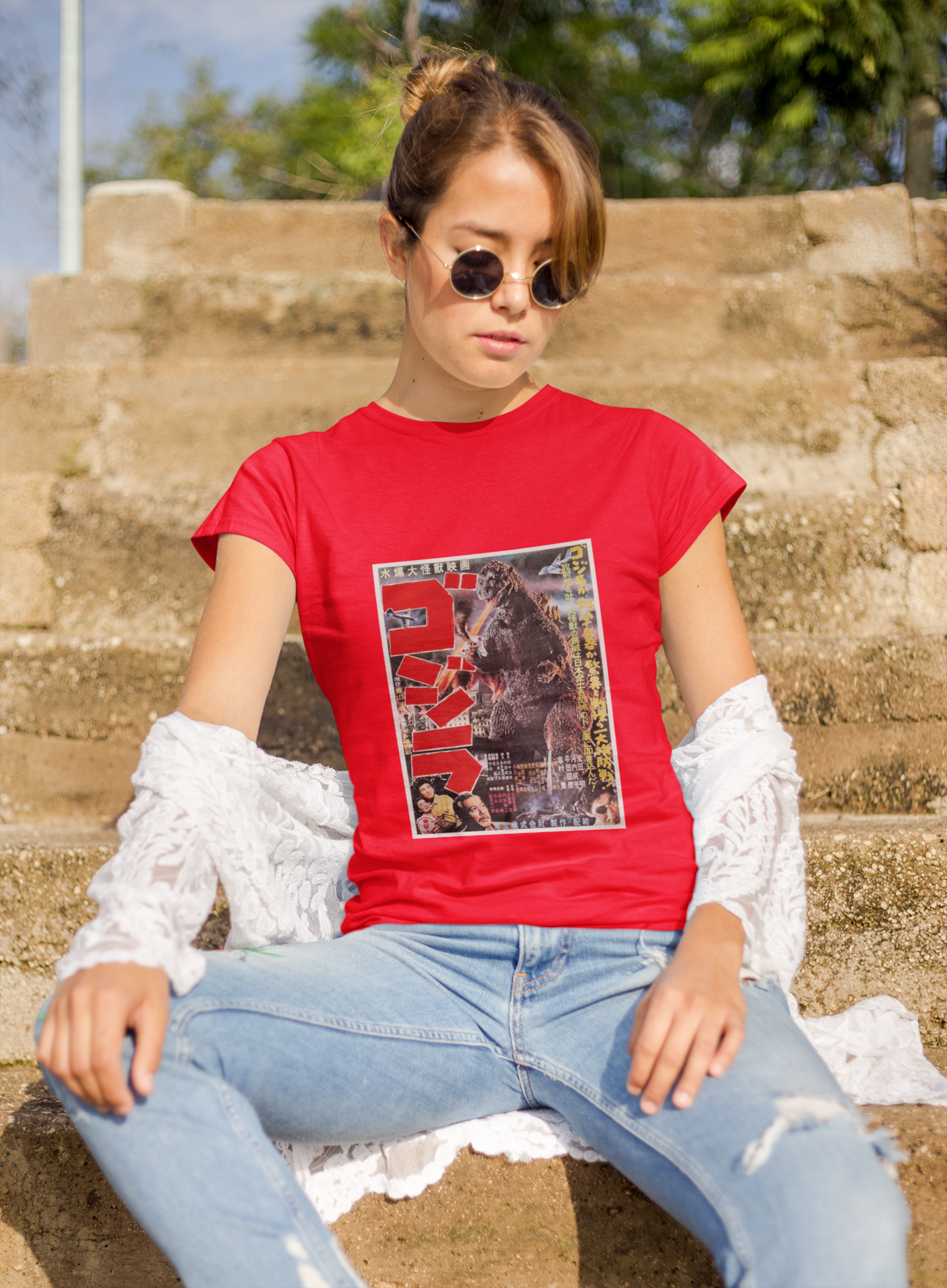 a woman wearing a red japanese godzilla  t - shirt