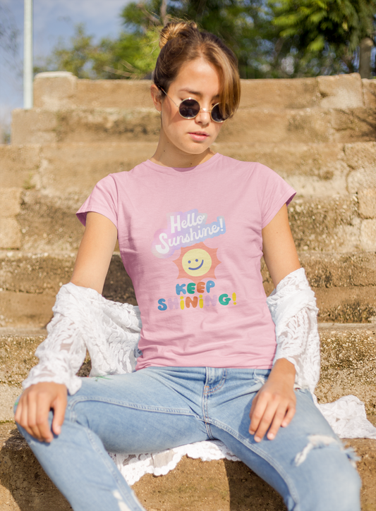 a woman wearing a pink letter and expression T-shirt