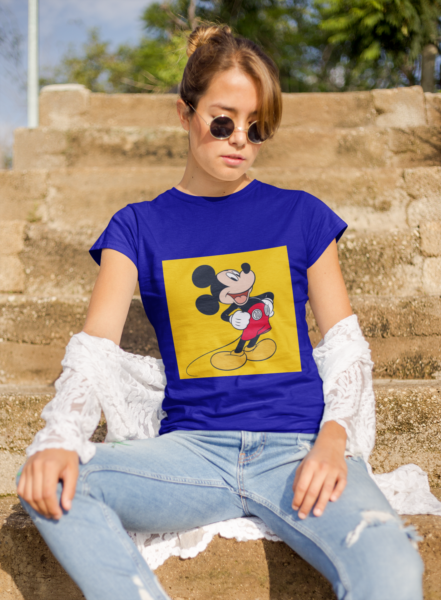 a woman wearing a blue Mickey mouse T-shirt