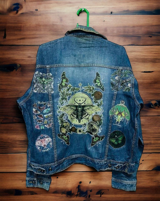 a denim jacket with pictures of bohemian moth printed on it