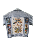 Denim jacket with mushroom illustrations on a white background
