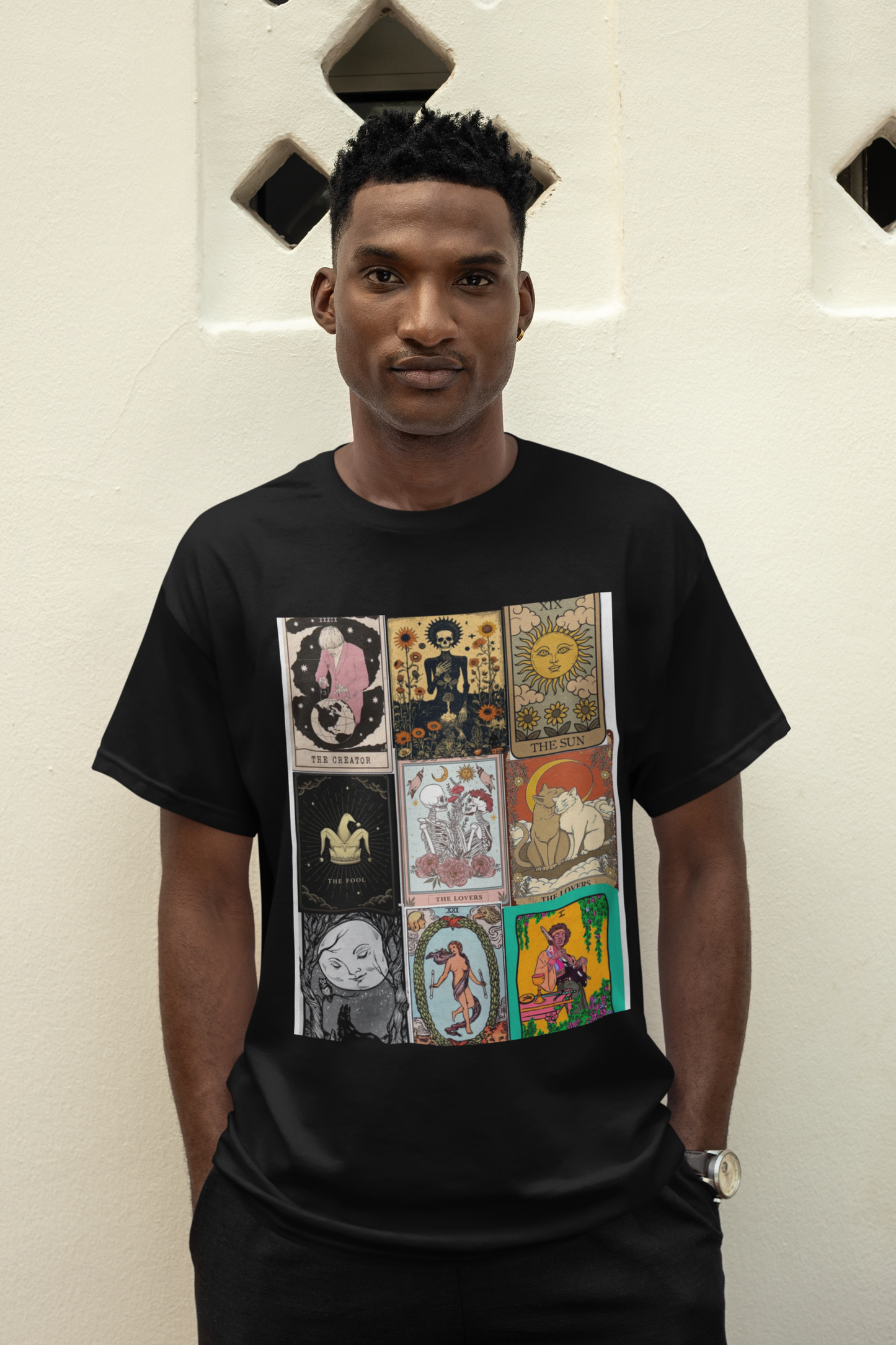 a man wearing a black Tarrot card design T-shirt