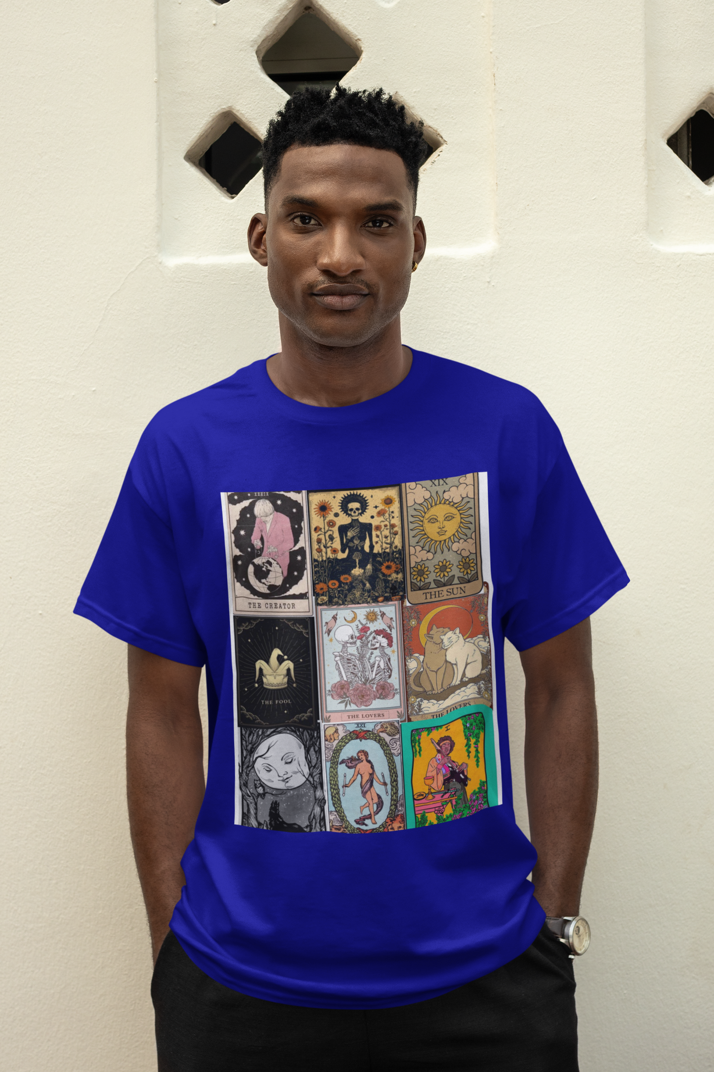 a man wearing a blue Tarrot card design T-shirt