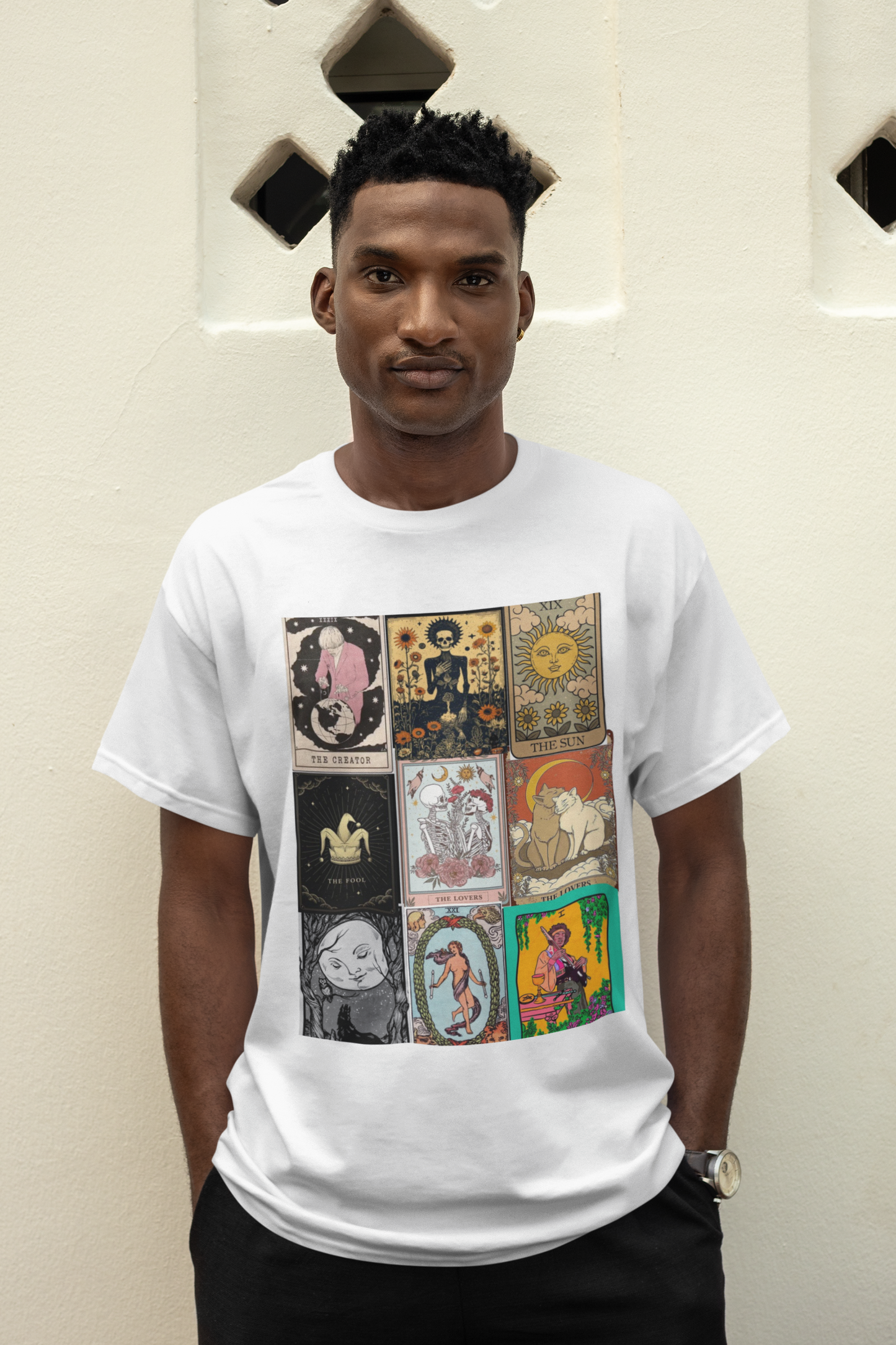 a man wearing a white Tarrot card design T-shirt