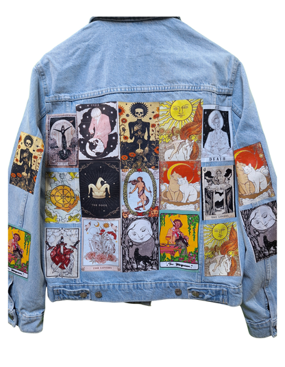 Light blue denim jacket with tarot card designs on a white background